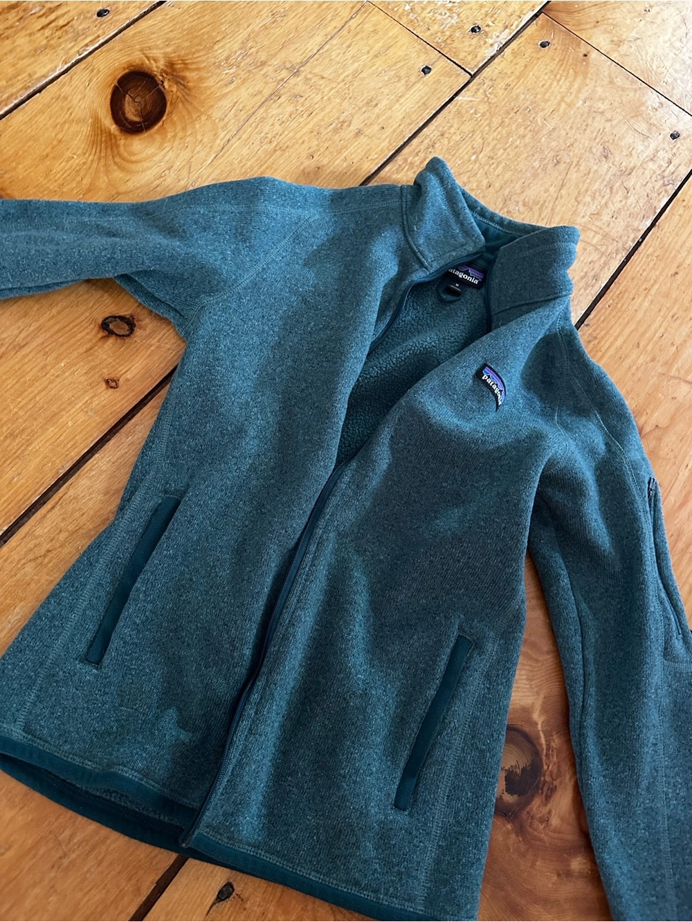 Green zip up Patagonia fleece
